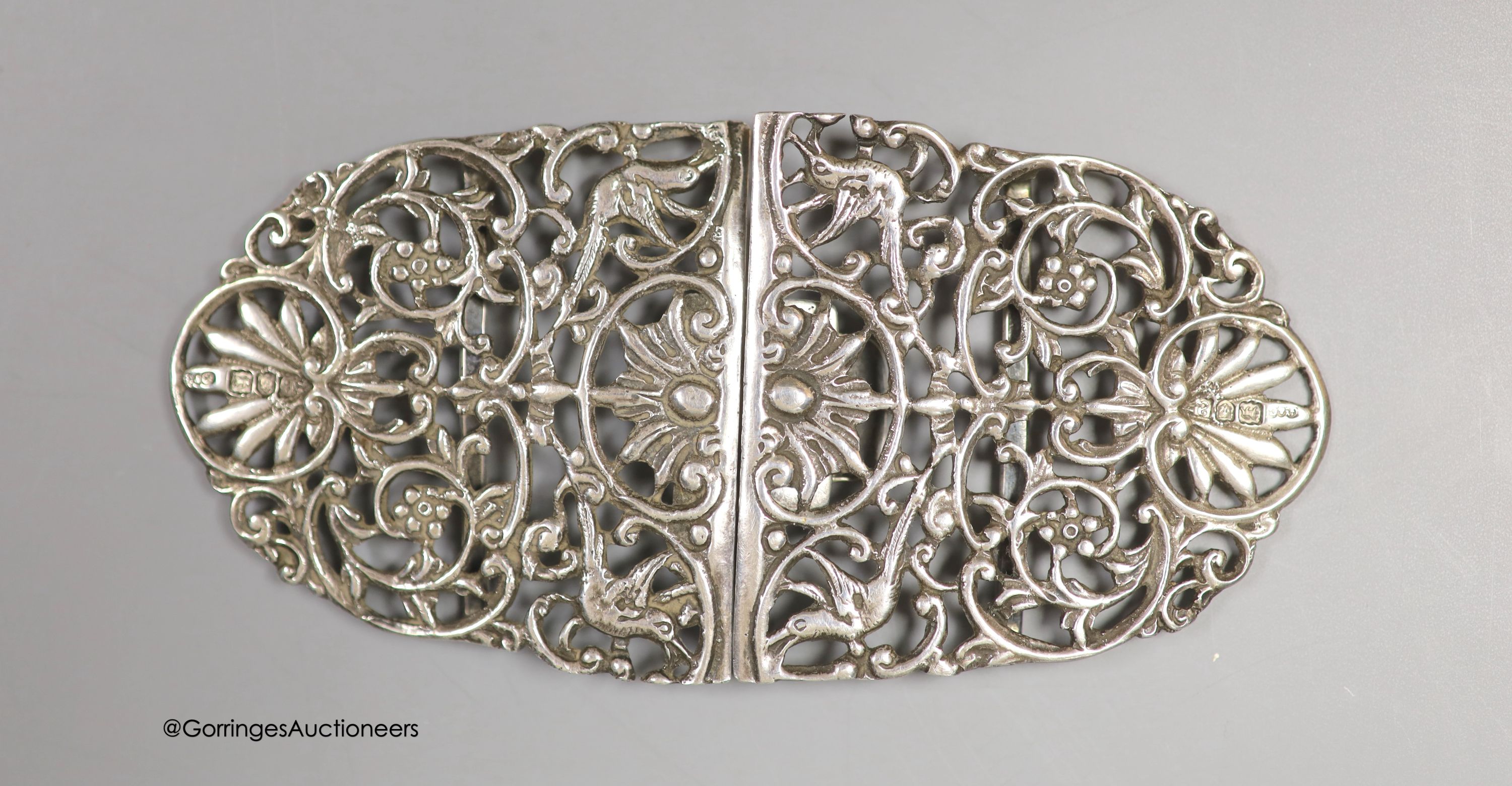 A late Victorian pierced silver oval nurses buckle, by Grey & Co, London, 1896, 13.2cm, 85 grams